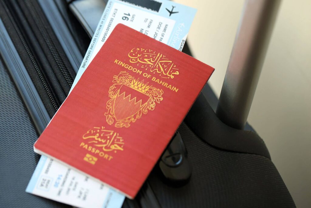 A citizen uses a laptop to get your bahrain passport online securely